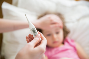 thermometer measuring a child's fever